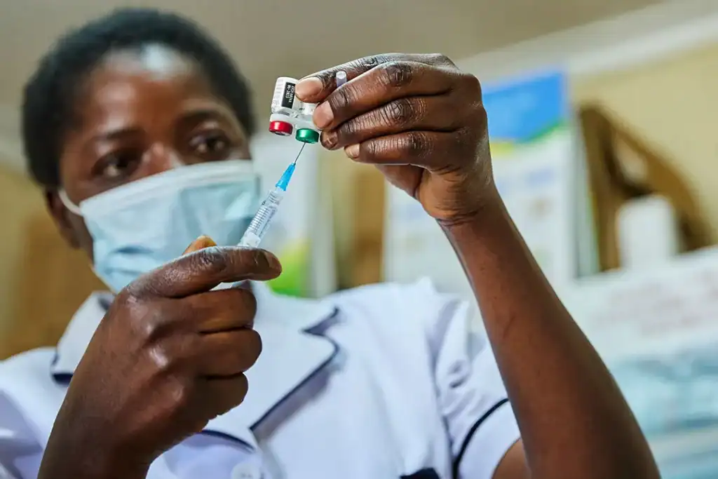 A health worker administers a routine childhood vaccine at a Nigerian primary health centre