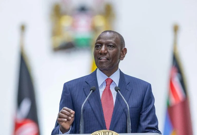 President William Ruto speaking at a podium about the Social Health Authority in Kenya.