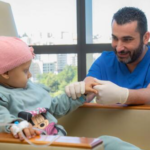 who global childhood cancer gap - pediatric patient receiving treatment at clinic