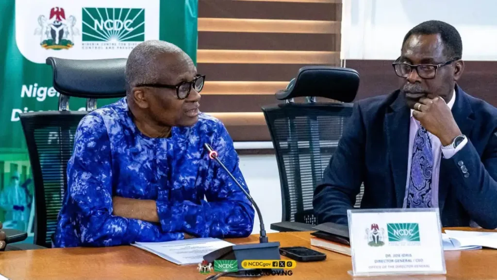 NCDC Director-General Jide Idris discussing support for Ebola contacts in quarantine